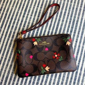 Coach Floral Wristlet Brown Background